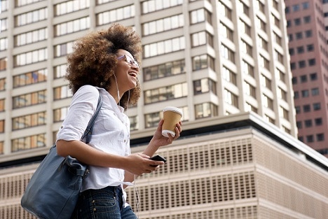 Smiling african american woman walking
