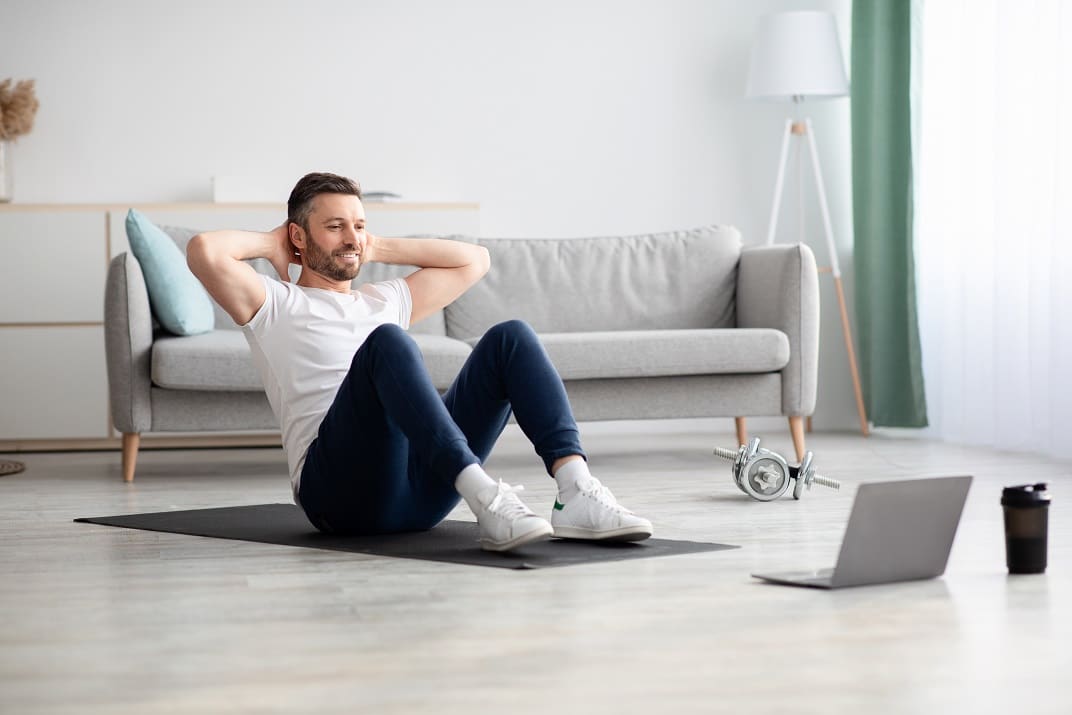 Smiling bearded man working on ab